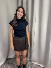 Elegant Black Knitted Top paired with jeans for a casual look